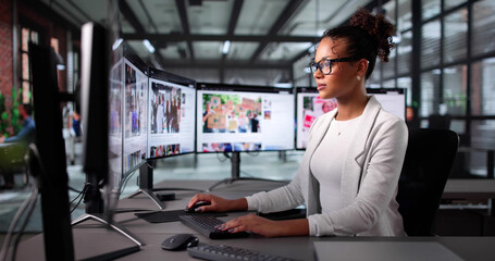 Young Female Journalist Reading Online News Article