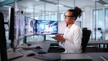African American Female Doctor Holding Online Medical Meeting