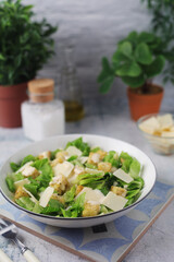 A bowl with classic Caesar salad