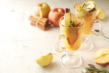 Warm apple autumn drink with cinnamon