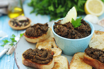 A bowl with tapenade - traditional olive dip in Mediterranean region	