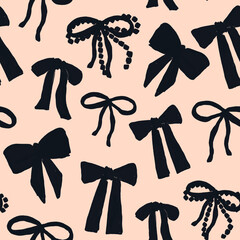 Black bows on pastel background create a stylish pattern for fashion or decoration needs