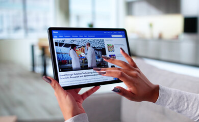 Black Woman Reading News Online At Home