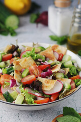 A bowl with Fattoush - Traditional Levantine salad