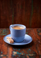 Cup of coffee on rustic wooden background. Soft focus. Copy space	