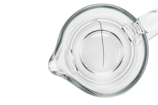 Top view of a black hair contaminating a glass measuring cup on a transparent background