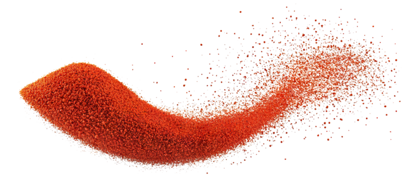Red paprika powder burst in dynamic motion, isolated on transparent cutout background