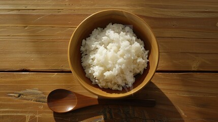 Rice, Wooden Spoon, and Bowl – a warm and rustic composition. The natural textures and earthy tones create a cozy, homey kitchen atmosphere.