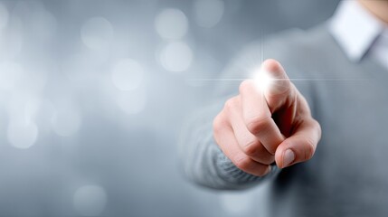 Hand Pointing Forefinger with Light Beam on Finger Against Soft Focus Blurred Background in Studio Shot