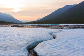 Snow on the bank of the river Hoisey. Polar day on Putorana Plateau, Taimyr, Russia