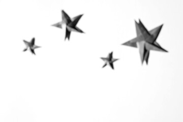 Christmas Abstract Defocused Backdrop with Origami Stars. Handmade Decorations.  DIY.     