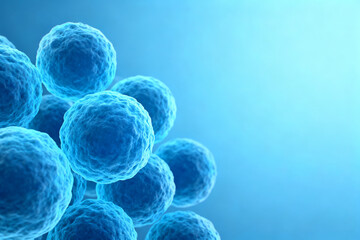 Microscopic view of blue spherical cells against a gradient blue background