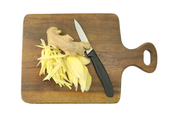 cutting board with a knife on a cutting board, Fresh ginger root with skin and peel sliced on cutting board with black handle knife isolated on white background top view flat lay stack