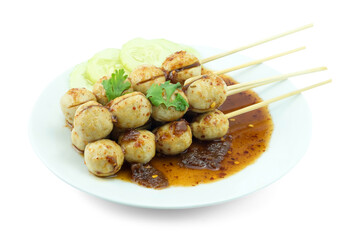 Toasted meatballs with spicy sauce, cucumber and garnish with green coriander leaves  in white dish  isolated on white background top view flat lay clipping path stack.