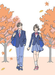 秋の並木道を歩く制服姿の男女