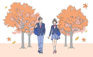 秋の並木道を歩く制服姿の男女