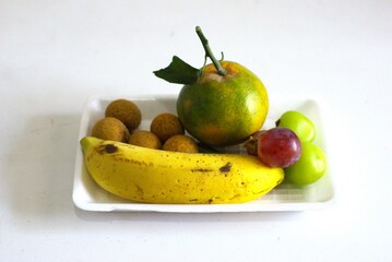 Assorted Fresh Tropical Fruits on White Tray