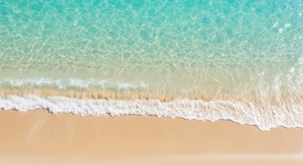 Aerial view of a serene beach with gentle waves and sandy shoreline in soft teal and sand tones