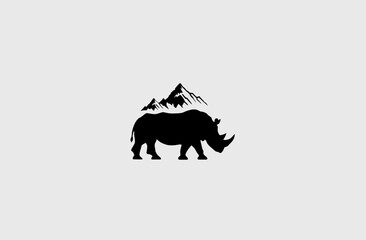 Black silhouette of a rhino with mountains above, centered on a light gray background