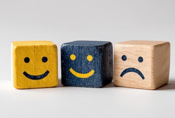 Three whimsical wooden cubes featuring a bright yellow smiley face, offering a playful and cheerful vibe for creative projects, branding, or educational materials, conveying happiness and positivity.