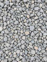 aggregate - a stack of gravel / grit of glauconite sandstone, dark and light gray coarse stones, crushed and broken at a stone pit to similar sizes. The colors and shapes are very irregular.