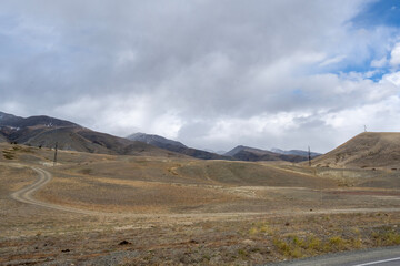 Fototapeta premium A beautiful landscape with mountains and autumnal yellow trees in the Altai Mountains.