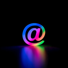 Illuminated at symbol with rainbow gradient on black background email internet isolated on a transparent background