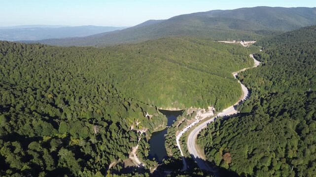 Aerial view of winding asphalt mountain road among green trees in summer. (Domani&ccedil;,İneg&ouml;l dağ yolu)	