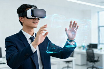 Man in suit using virtual reality headset to interact with holographic interface in modern office setting