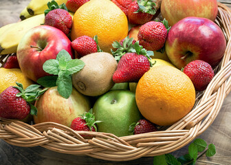 Organic fruits close-up in wicker basket