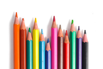 colorful arrangement of colored pencils on a white background.
