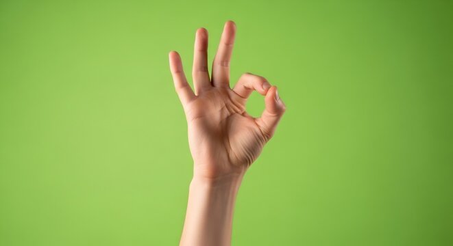 Woman hand gesture showing ok sign on green screen background. Effect for chromakey.