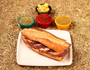 a photo of a fried kokorech sandwich