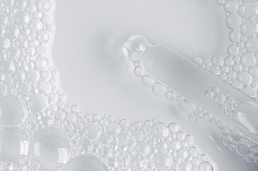 Bubbles of body gel or soap foam or shaving gel. Closeup. Copy space
