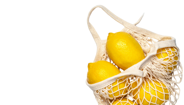 Fresh lemons in a reusable shopping bag