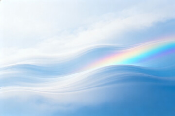 A serene sky with soft clouds and a vibrant rainbow arching over gentle waves.