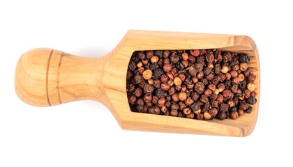 Assorted peppercorns in a wooden scoop