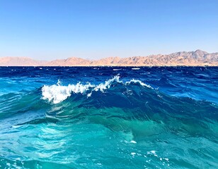Azure waves crashing on a clear sea