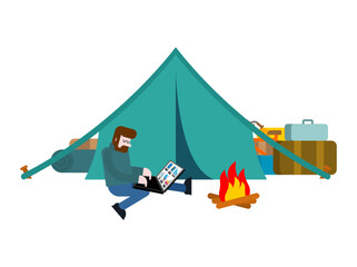 man working on laptop at camping site with tent. Symbol of freelance, remote work, and digital nomad lifestyle. Perfect for work, travel, and outdoor projects.
