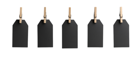 Five blank black tags hanging on wooden clips in a row against black background