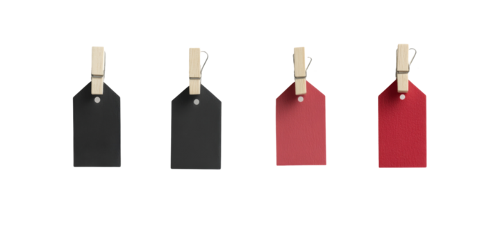 Black and red tags with wooden clothespins in a row