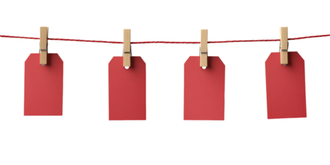 Four red tags hanging on clothesline with wooden pegs
