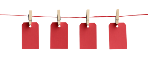 Four red tags hanging on a clothesline with wooden clothespins