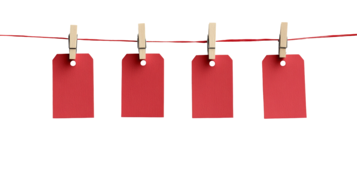 Four red tags hanging on a clothesline with wooden clothespins