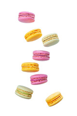 Flying multicolored French macarons on a light background.