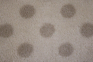 Beige fleece fabric texture with polka dot pattern, soft textile background