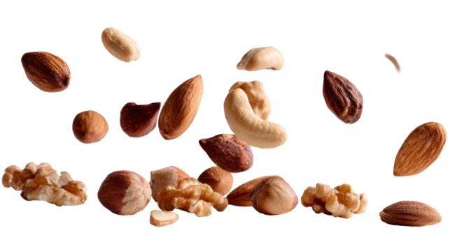 Assortment of nuts and seeds falling isolated on transparent background