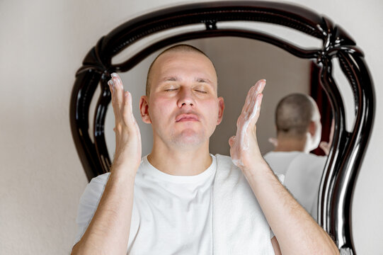 Man Skincare Routine at Home Mirror