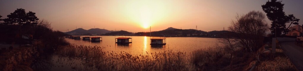 Fototapeta premium sunset over the river