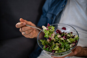 Man eating fresh healthy salad for lunch